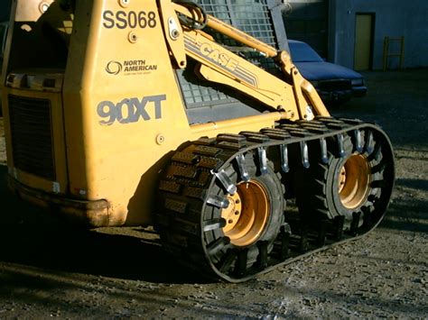 skid steer tracks over the tires|bobcat rubber tracks over tires.